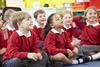 Primary school children sat in a classroom