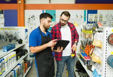 Man dealing with customer in hardware store