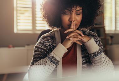 Woman with eyes closed in deep thought