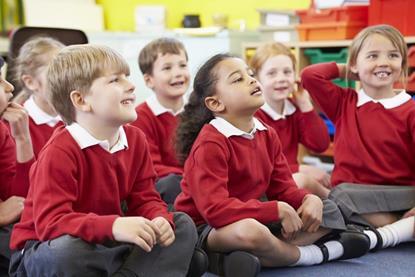 Primary school children sat in a classroom