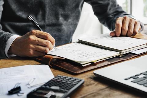 Man making notes at desk